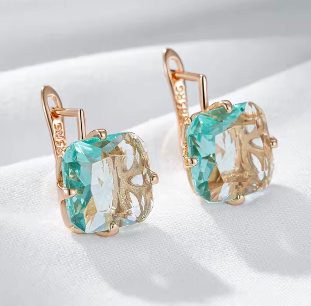 [S169] Arete Artemisa de Aquamarina de acero con baño rosado